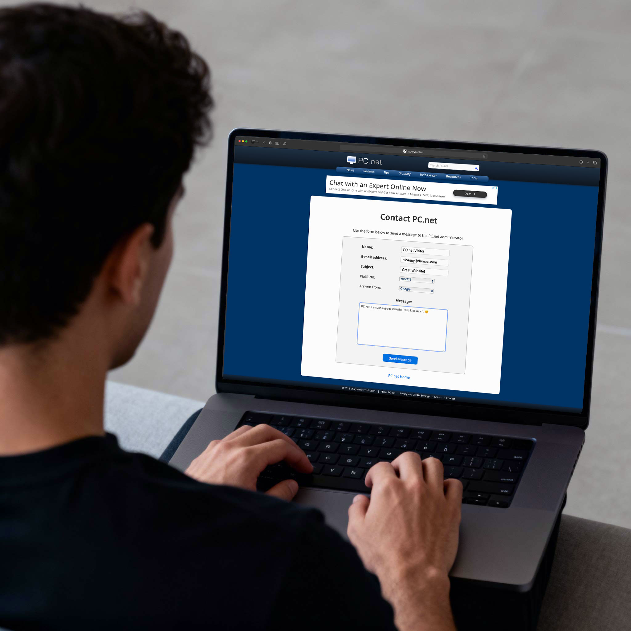 Person writing a message to the webmaster